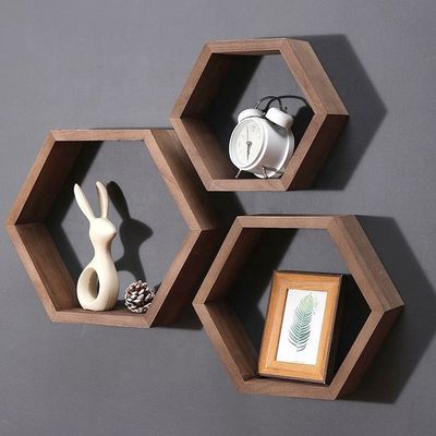 Estantes de pared de madera de forma hexagonal geométrica para el organizador de oficinas de estilo moderno simple