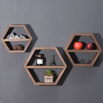 Estantes de pared de madera de forma hexagonal geométrica para el organizador de oficinas de estilo moderno simple
