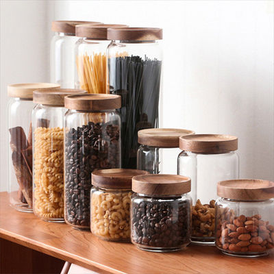 Capacidad personalizada Envasado sellado borosilicato redondo transparente recipientes de vidrio de embalaje Jar con tapa de madera