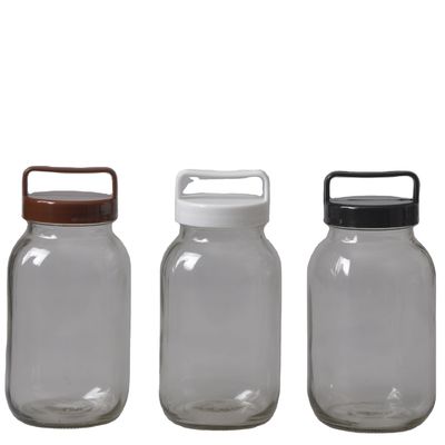 Jarrón de vidrio de almacenamiento elegante y transparente con cubierta de plástico de colores 100% seguro para alimentos